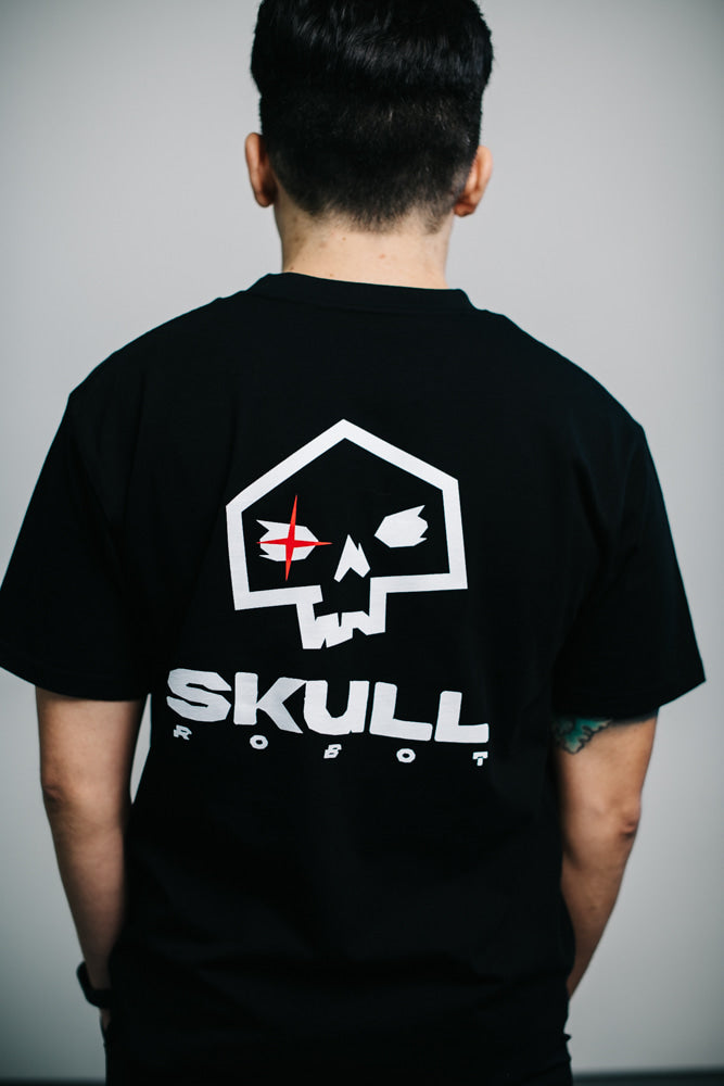 skullrobot logo close up on black shirt